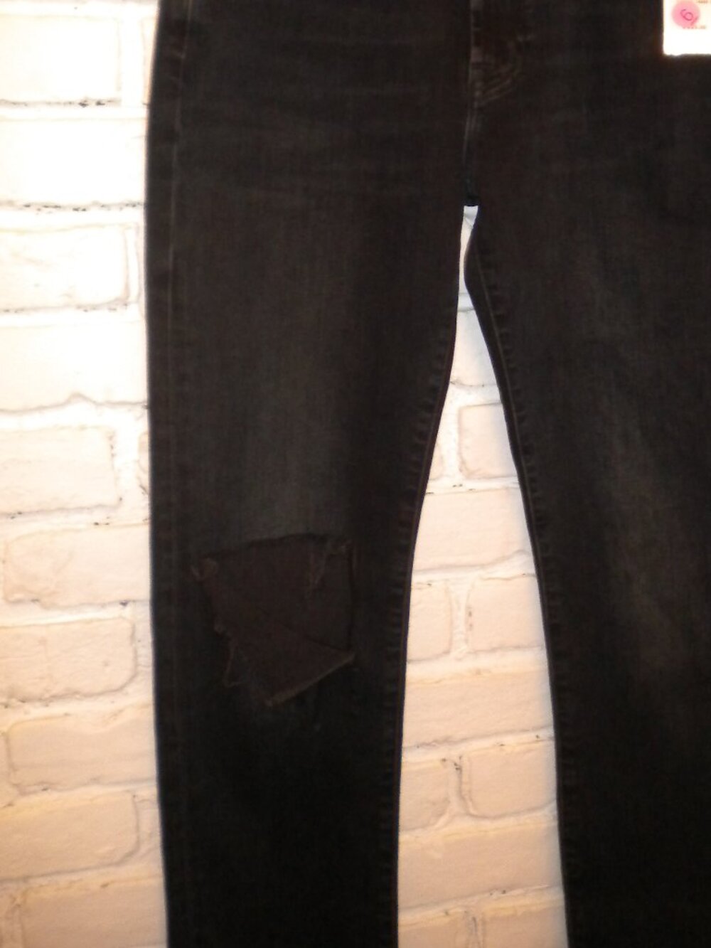 Stylish dark wash 7 For All Mankind jeans featuring intentional distressed knee